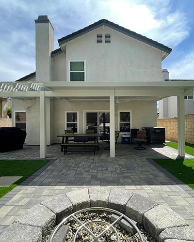 Back Yard with Pavers Turf Patio Cover and Fire Pit Sitting Area in Moorpark