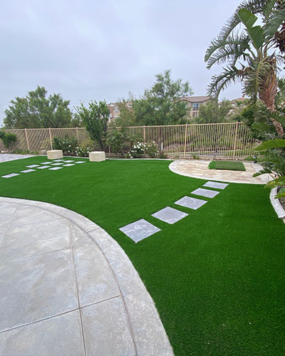 Back Yard with Pavers Turf Stepping Stone in Rancho Cucamonga