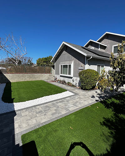 Front Yard Remodel with Pavers Turf and White Gravel in Sherman Oaks